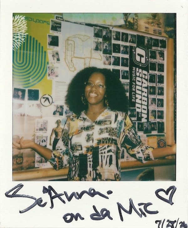 a signed polaroid with a woman in it