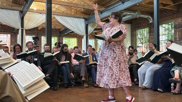 Poster Musicologist Angharad Davis leads her piece from The Sacred Harp
