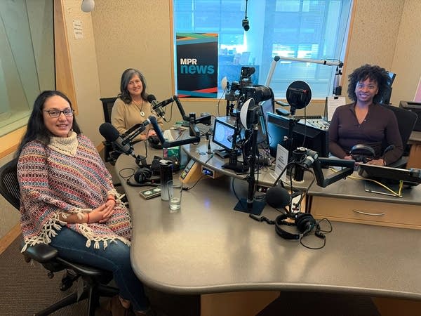 three women in a sound studio