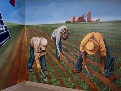 A mural of farmers working