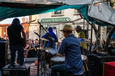 a band performing on an outdoor stage