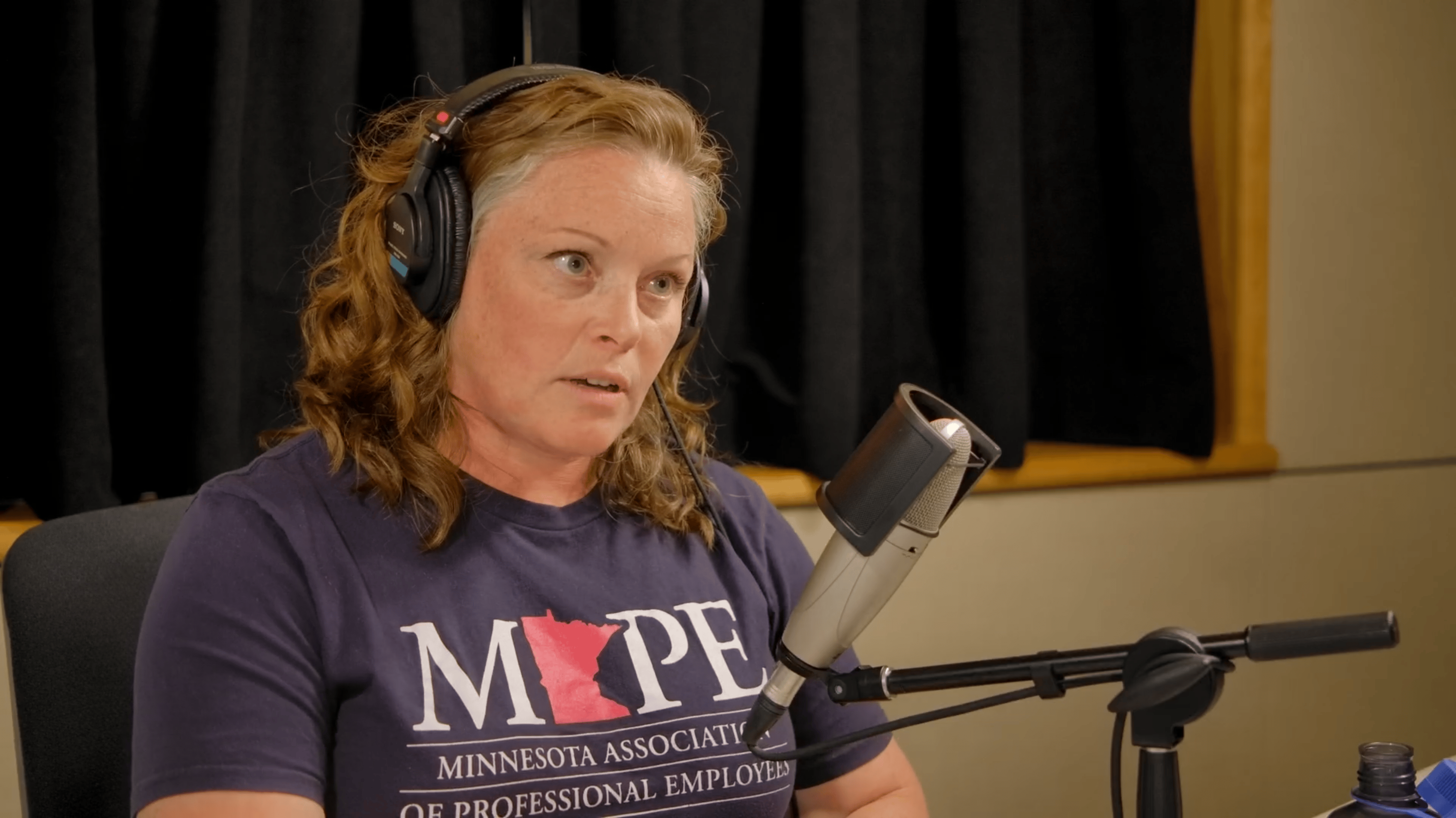 Megan Eiting, MAPE representative and DNR firefighter, speaks with MPR News host Clay Masters
