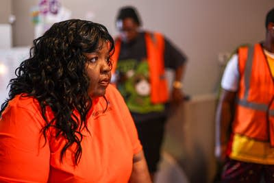 Connie Rhodes checks in with volunteers