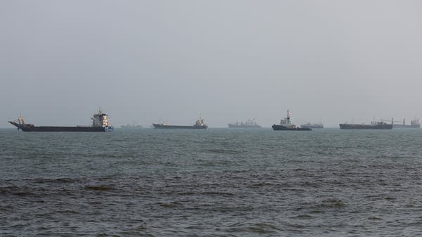 Above, ships anchored in the Strait of Hormuz on August 10 off the coast of Bandar Abbas, Iran.