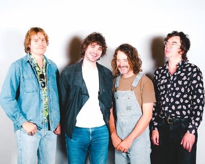 members of the band night moves pose for a photo