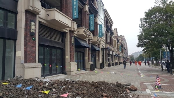 Some shop fronts are under construction.