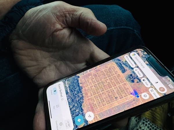 Close-up of a aerial map image on a person's phone.