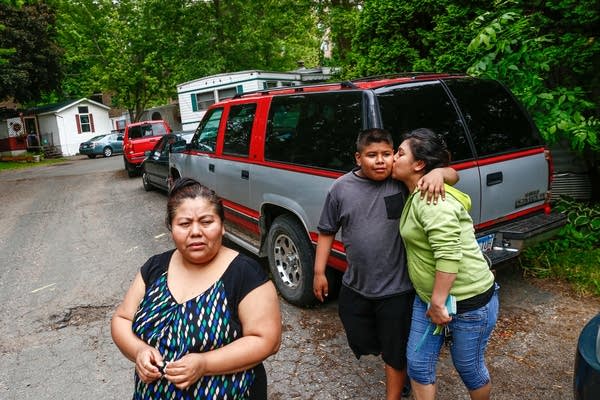 Lowry Grove residents walk to a neighbors home. 