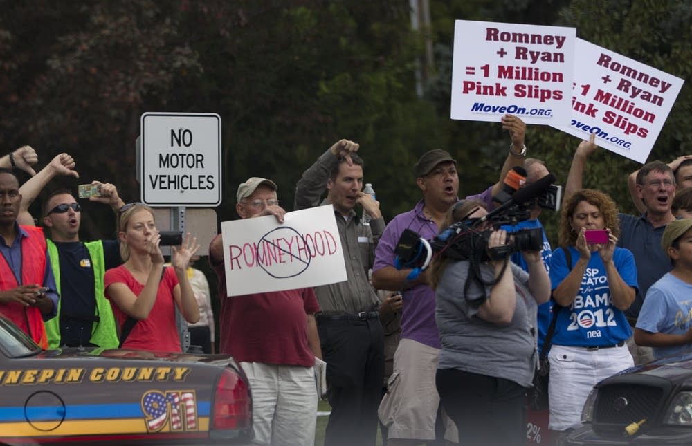 Protesters greet Romney