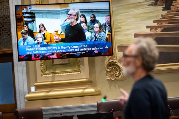 A man appears on screen as he speaks during a hearing