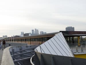 People walk near the Washington Avenue Bridge