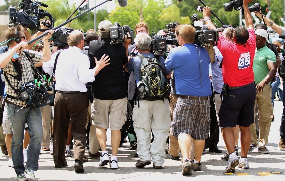 Zimmerman attorney Mark O'Mara surrounded