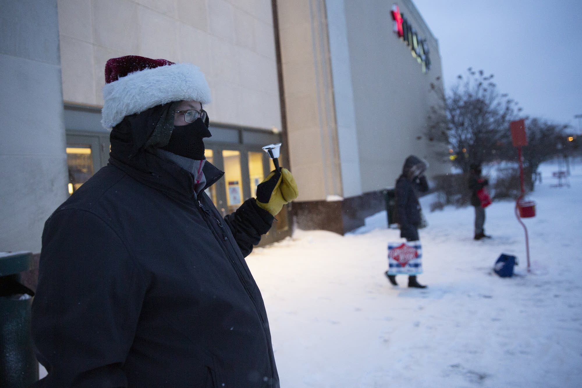 Paul Trusten (left) rings bells for the Salvation Army.