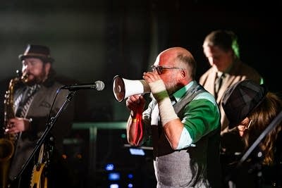 Several musicians performing together onstage