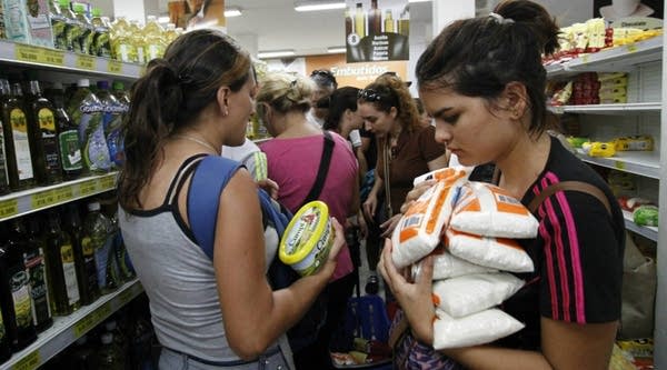 Venezuelans shop for groceries at a supermarket in Cucuta, Colombia. 