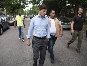 A protester questions Minneapolis Mayor Jacob Frey.