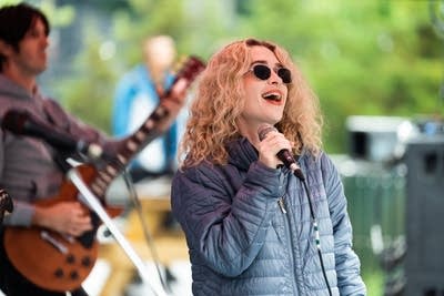 the band blondshell performing outdoors at a brewery