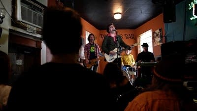 A band performing music in a bar in Minneapolis