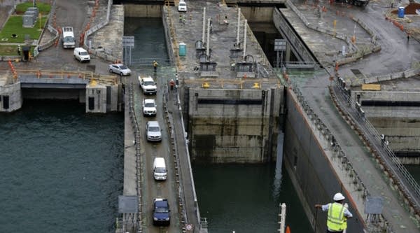 A worker stands next to the Agua Clara Locks during the second-day test of this Panama Canal lock in the Atlantic Ocean.