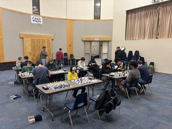 High school students playing chess