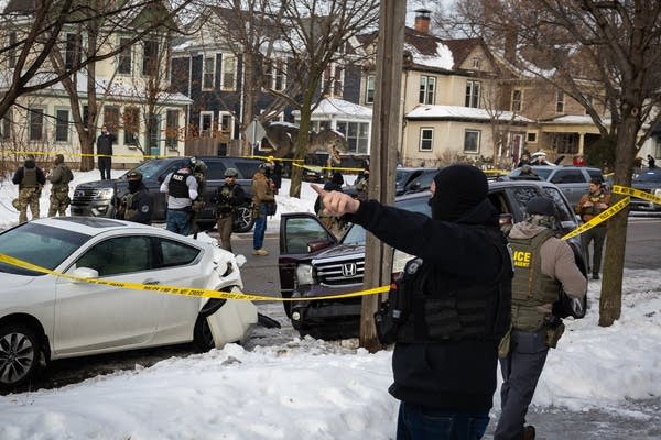 Agents surround a crashed car