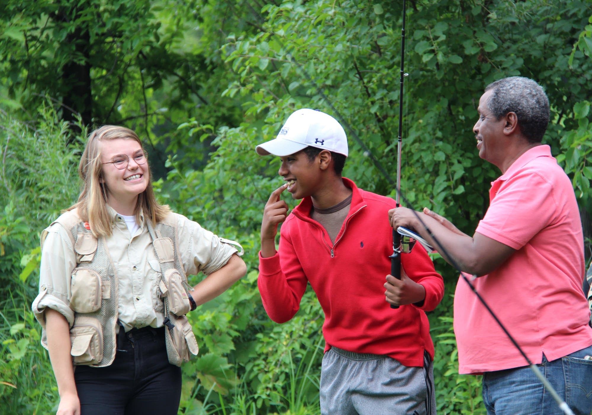Gabby Travers, left, Abdul Diriye, right, celebrate with Ishmael Diriye