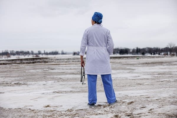 A physician stands
