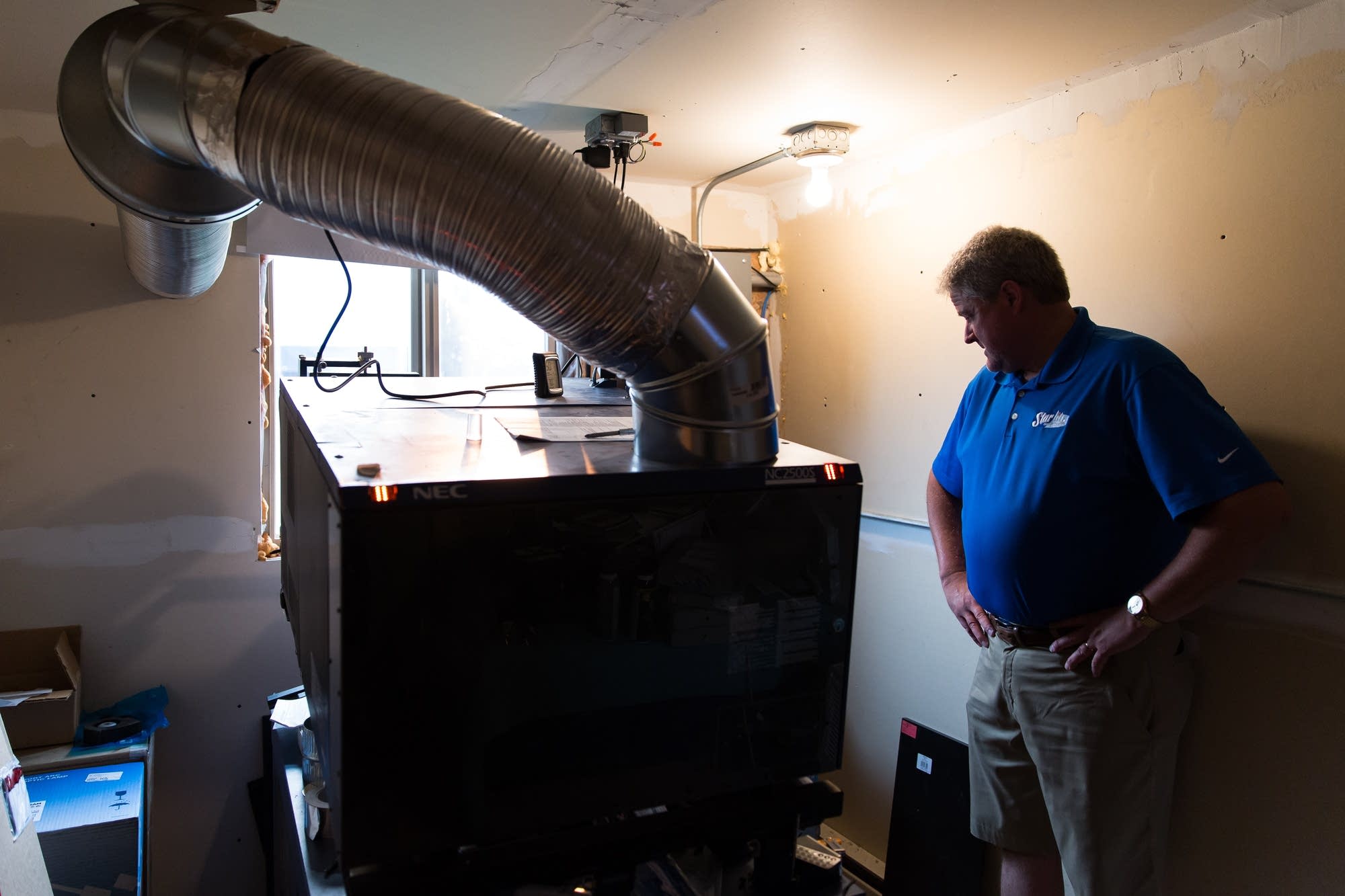 Dave Quincer waits for the projector system to boot up.