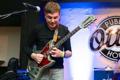 Man playing guitar on stage