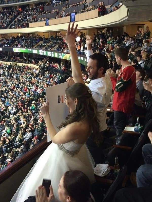 The bride, the burger, and a hockey game means instant fame for couple