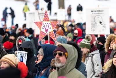 crowd of people with signs