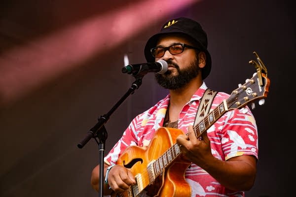 laamar and his band performing on stage