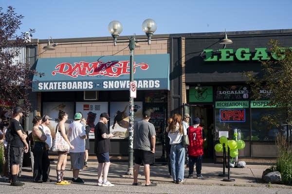 People line up outside a building
