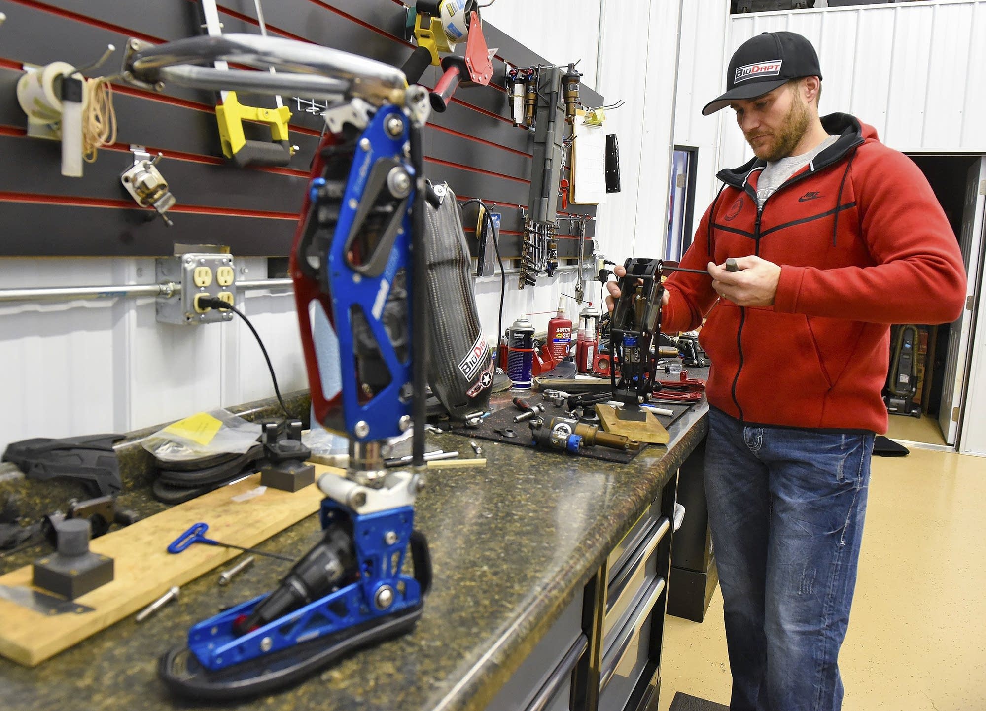Mike Schultz works on a performance prosthetic.