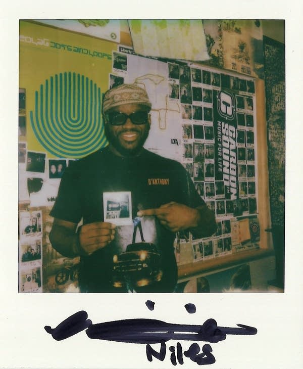 a signed polaroid with a man in it