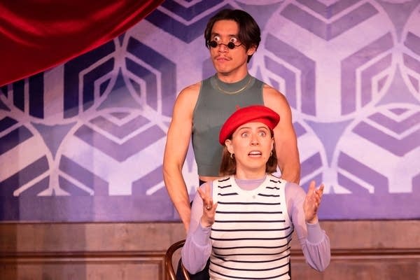 two actors perform on stage