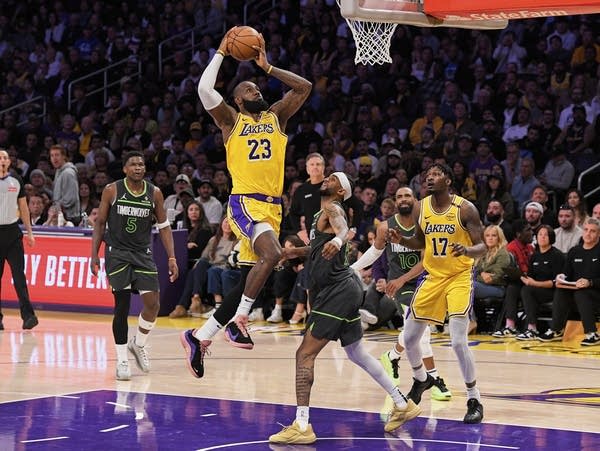 a basketbal player shoots