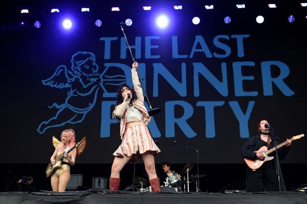 A band performing on an outdoor stage