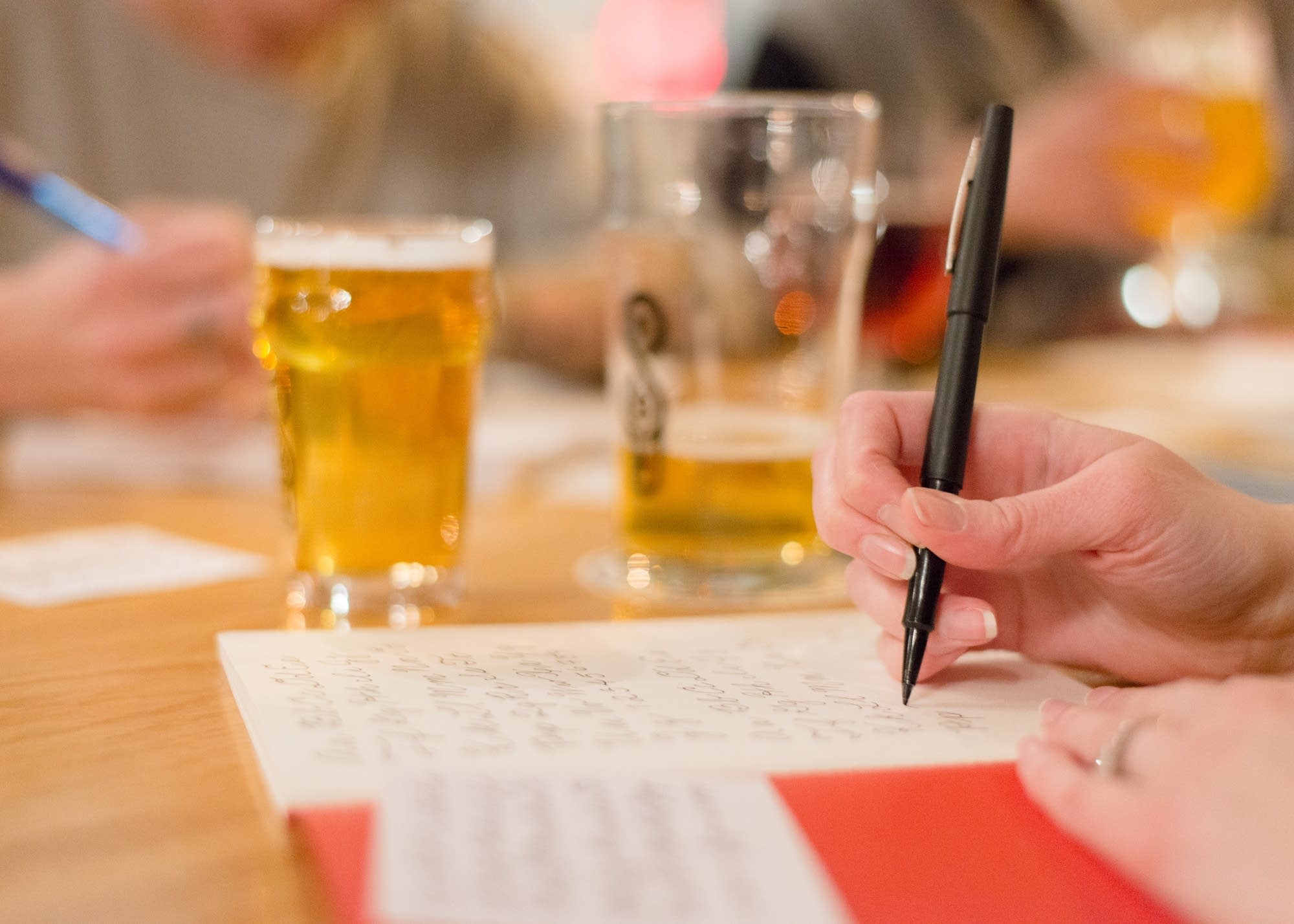Jenny Johns practices cursive writing during a Tiny Motor Things meet-up.