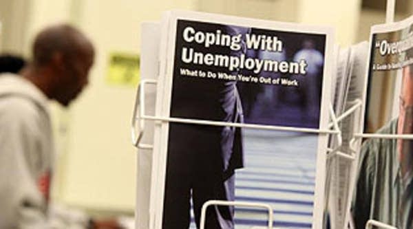 Pamphlets with information about unemployment are displayed at Eastbay Works Oakland One-Stop Career Center in Oakland, California.