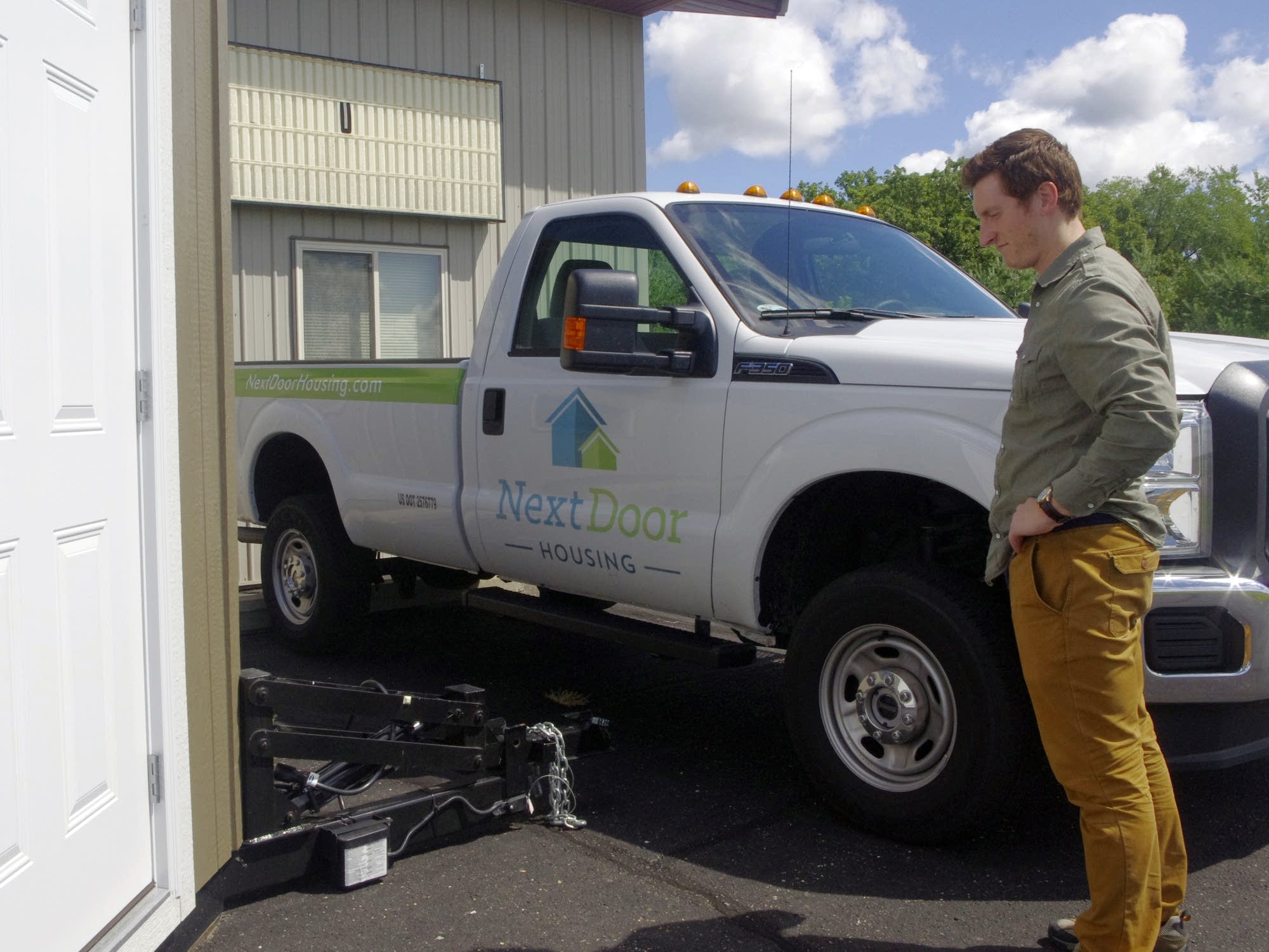 John Louiselle stands by the trailer hitch.