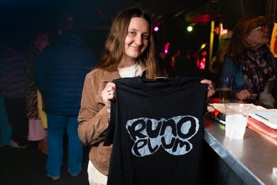 music fan with a runo plum shirt