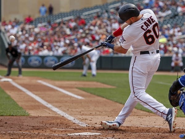 Cave's grand slam lifts Twins to sweep of Royals